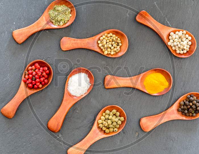 wooden tea spoons with various spices