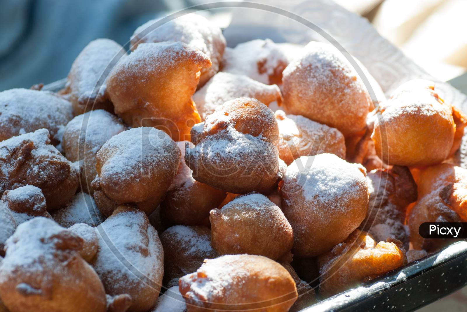 romanian traditional tasty delicious mini doughnuts with powdered sugar above ready for eat