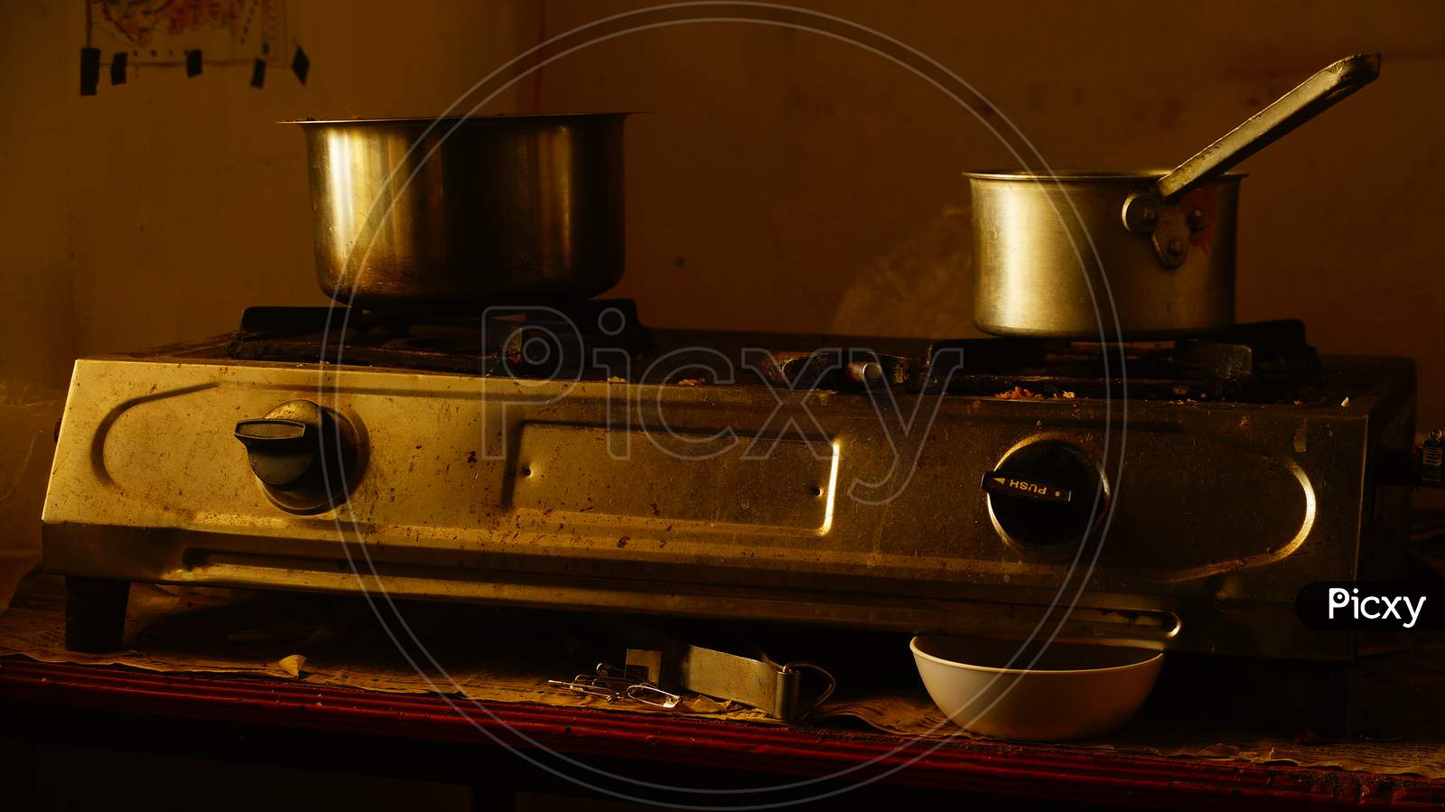 Two vessel kept on Gas Stove to boil milk and tea