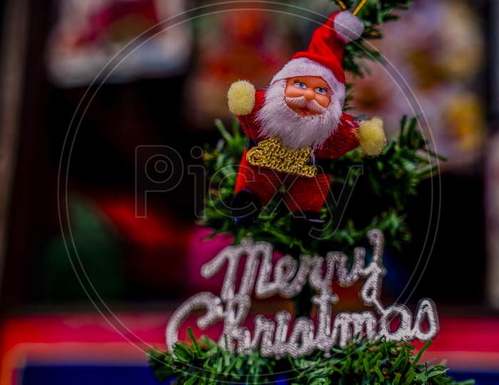 Decorated Christmas tree on blurred, sparkling and blurry background