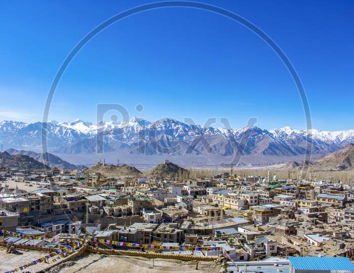 View Of Leh City From Mountain Top With Himalayan Mountain At Back