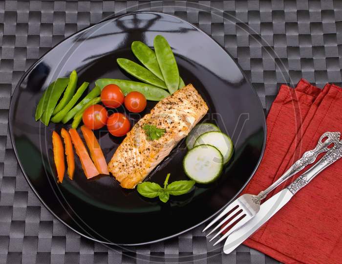 Grilled salmon stake on a plate