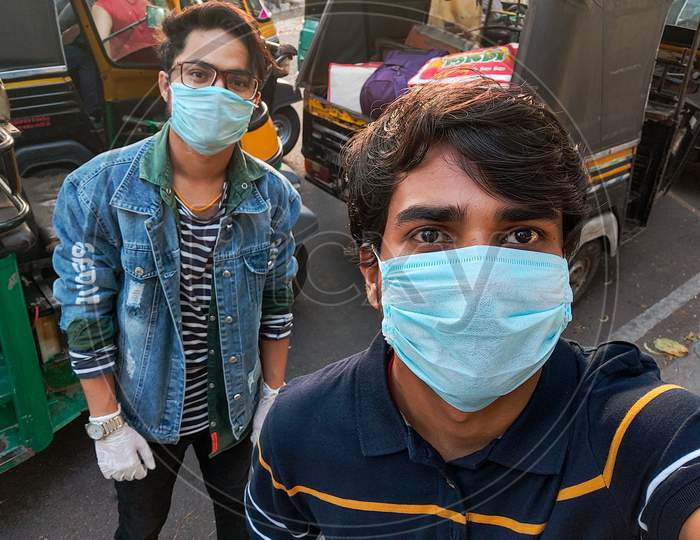 Students From Kota Rajasthan Are Returning From Kota To Their Home Town Bihar, Uttar Pradesh And Other States Of India During Coronavirus (Covid 19) Pandemic Lockdown. Face Covered Enjoying At Road.(Selective Focus On Foreground)