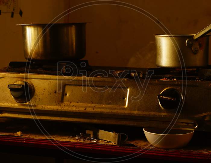 Two vessel kept on Gas Stove to boil milk and tea