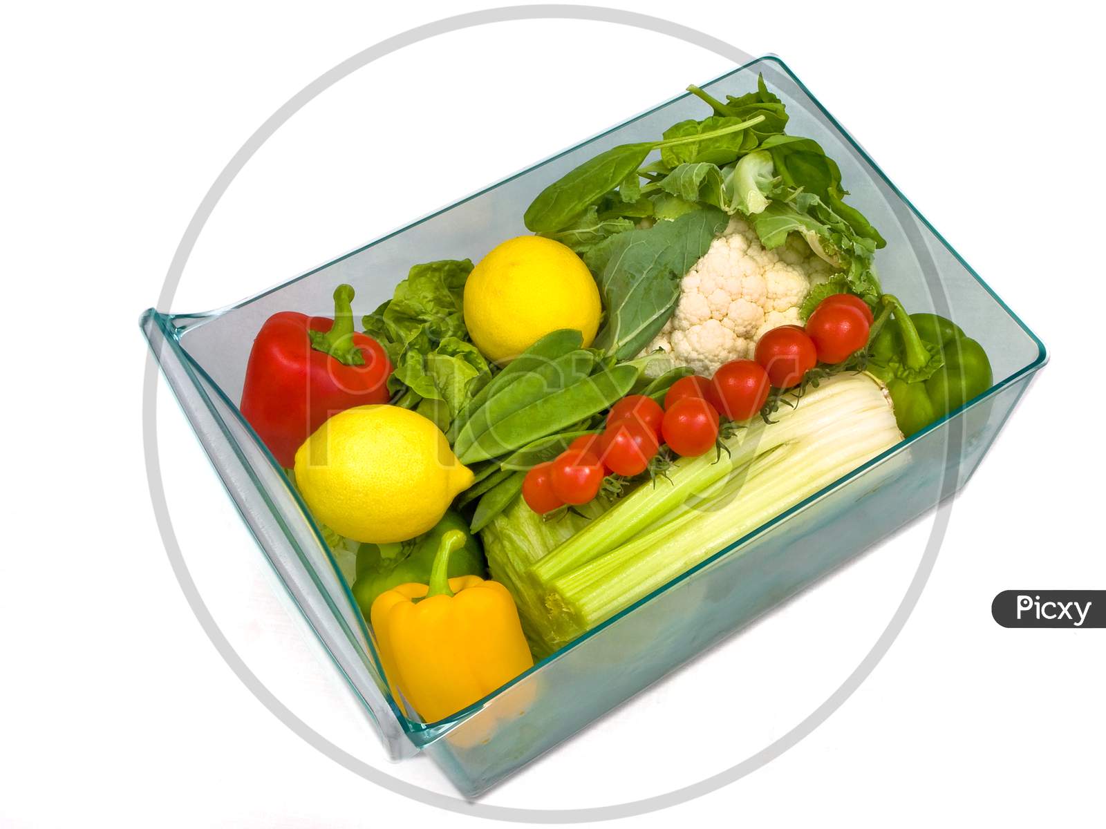 Refrigerator salad drawer full of salad and vegetables