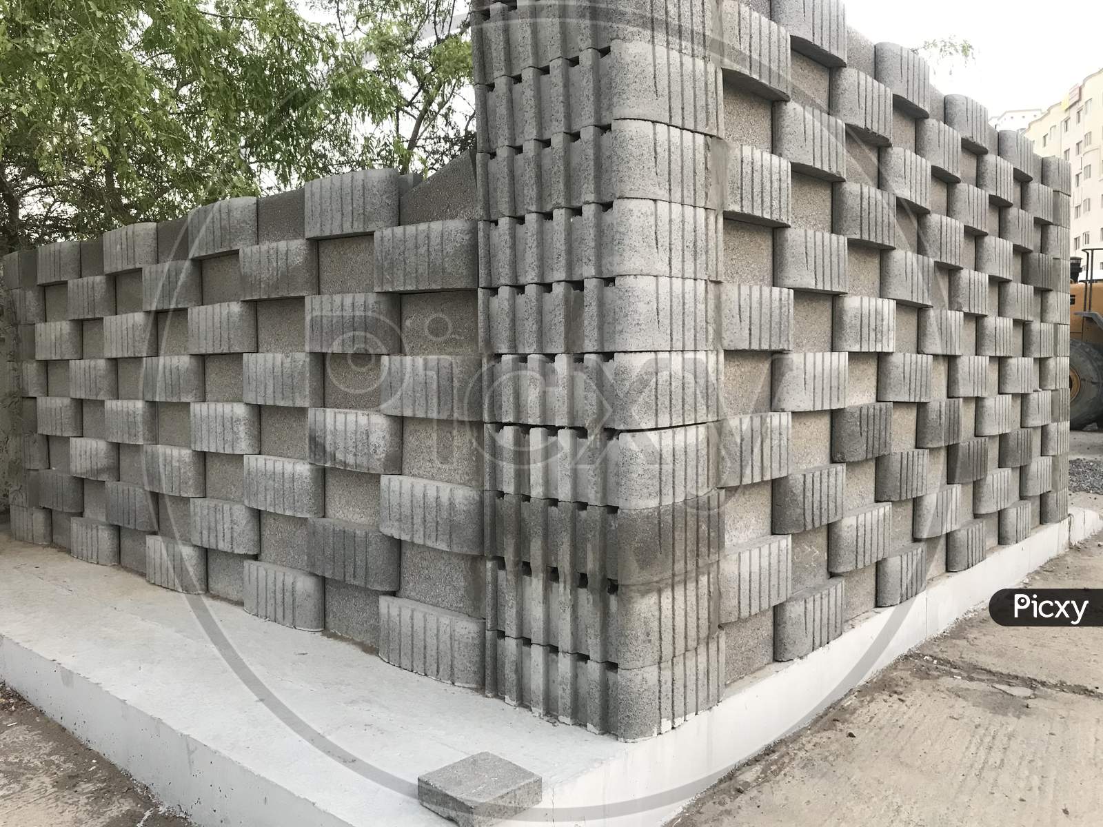 Isometric View Of Concrete Block Wall Constructed For Public Toilet In Three Dimensional View Like In And Out Pattern Using Blocks Cement And Sand