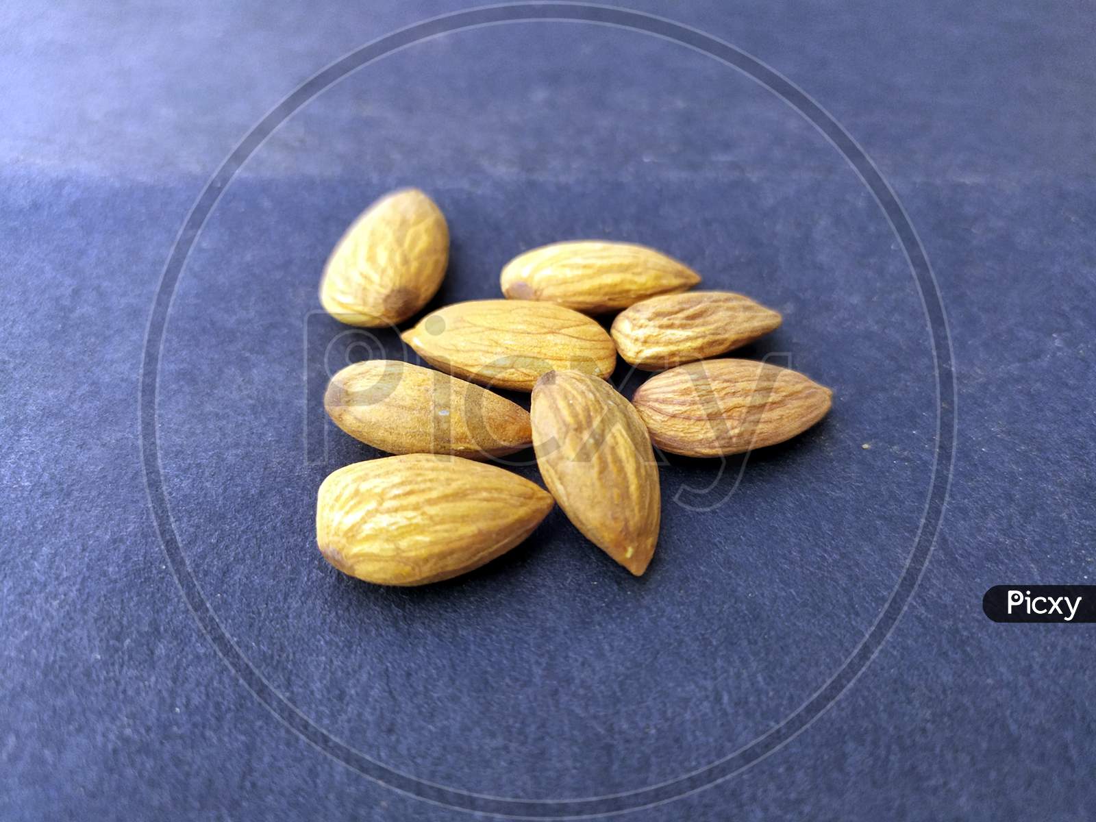 some fresh healthy almonds put on black background