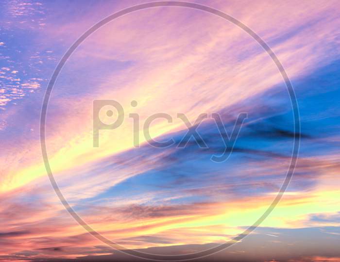 Panorama of stunning orange and red sunset clouds in the sky