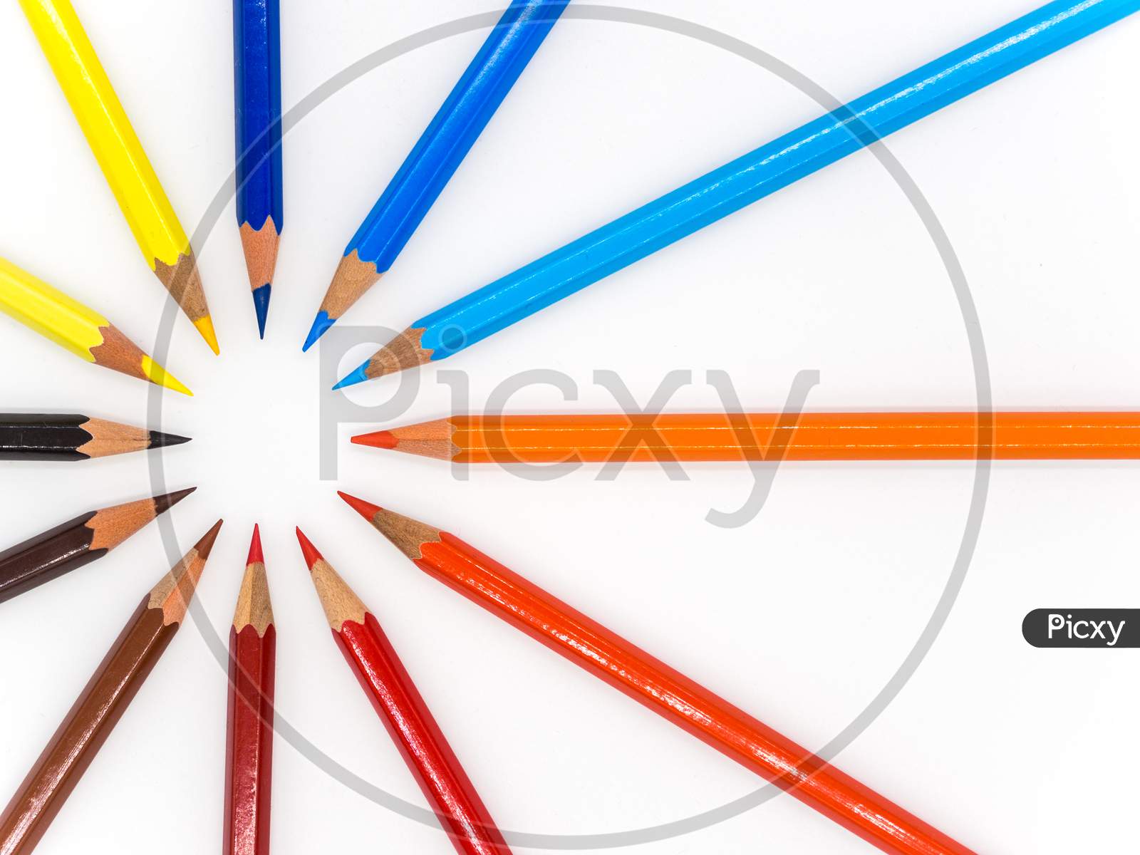 colored crayons arranged on white background abstract conceptual photo