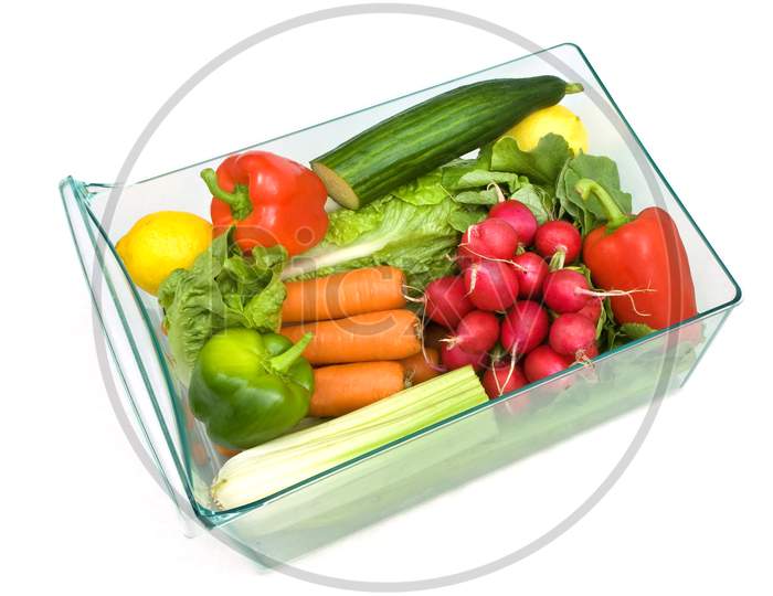 Refrigerator salad drawer full of salad and vegetables