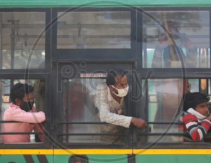 Migrant workers sit inside a bus as they wait to alight to board a special train arranged by the government to repatriate migrant workers from the Chikkabanavara Junction Railway Station on the outskirts of Bangalore, India.