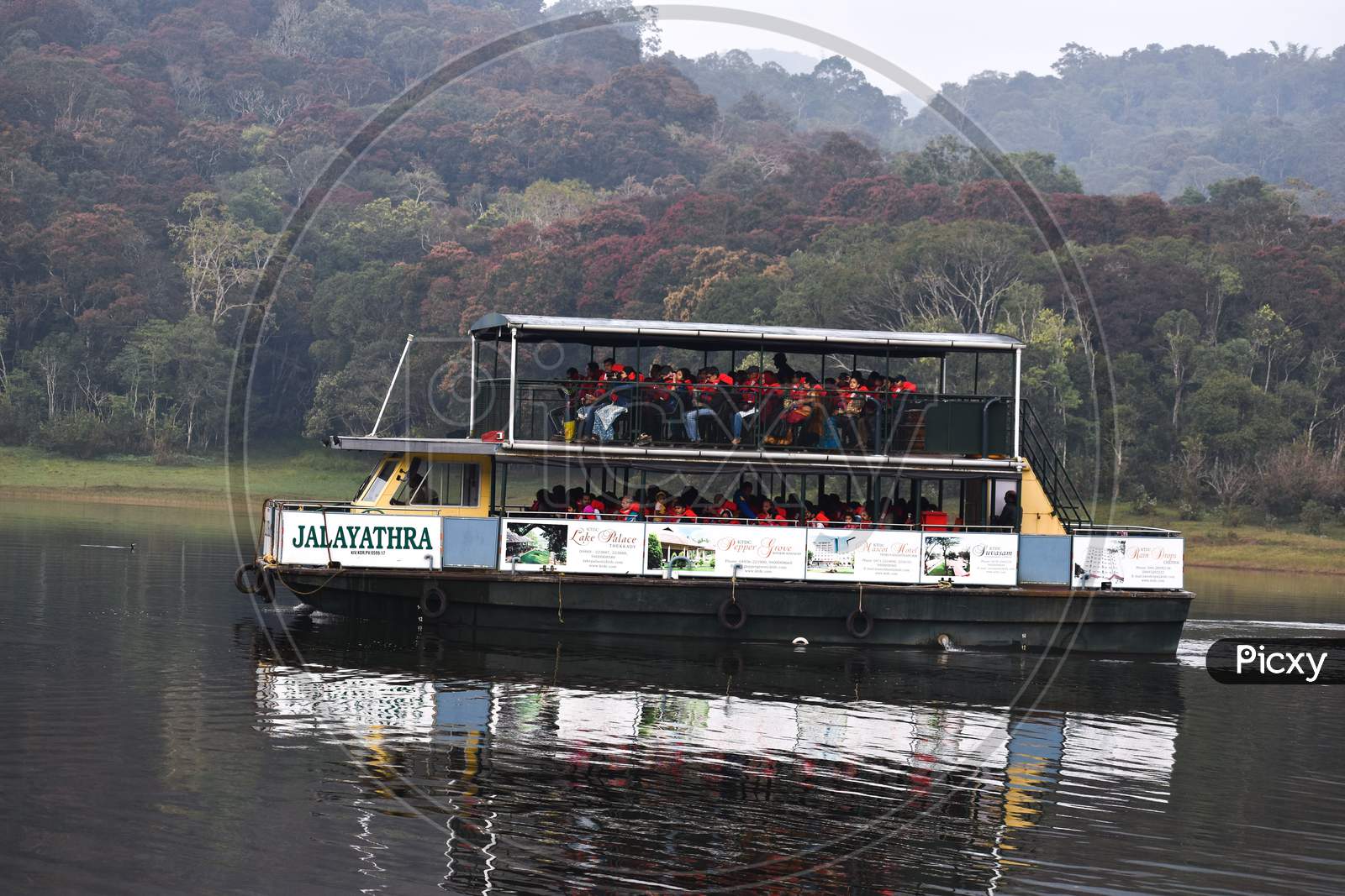 Cruise boat carrying tourist for tour in periyar sanctuary