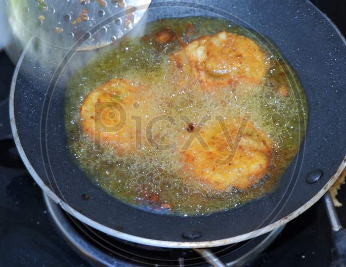 cutlets frying  in a pan
