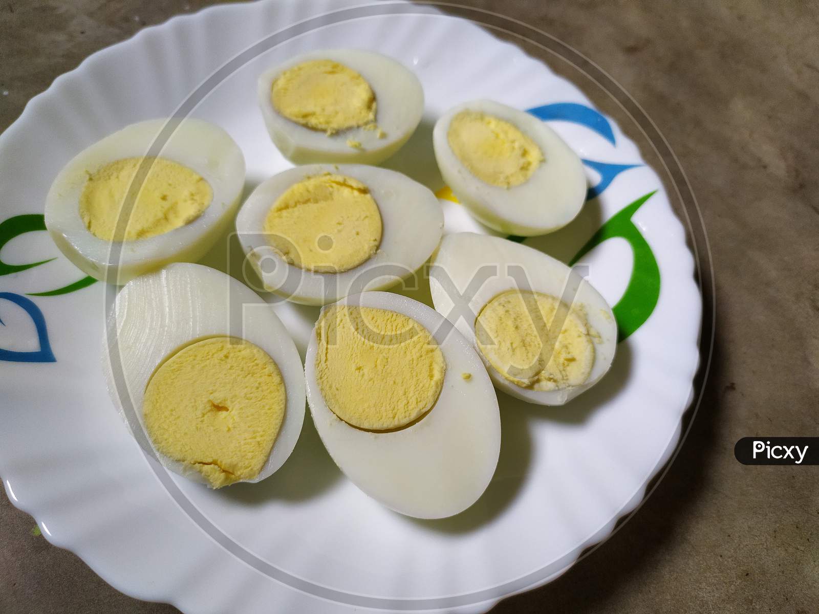 Boiled eggs on plate, Black background.