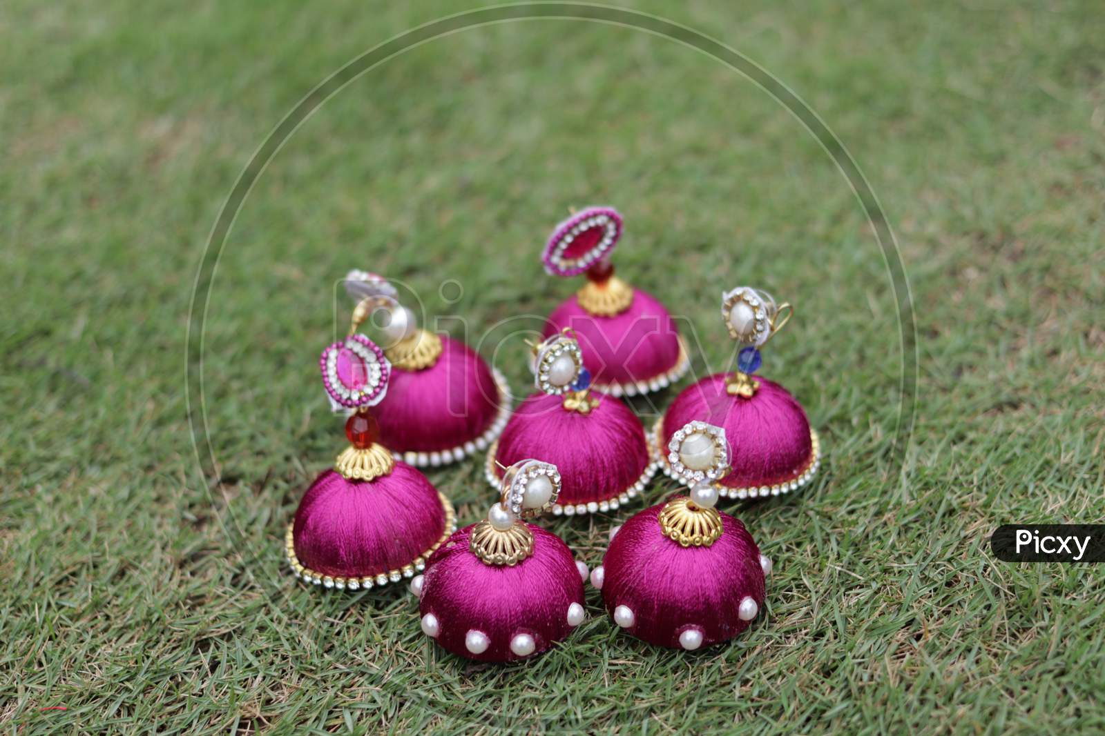 Hand made colorful Earring with nature background