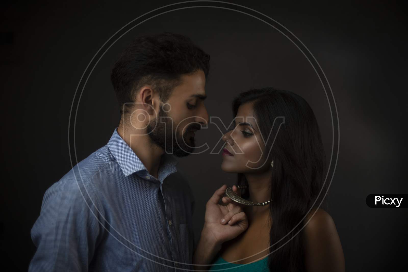 Image Of A Dark Skinned Indian African Girl And A Kashmiri European Arabian Man In Formal Wear