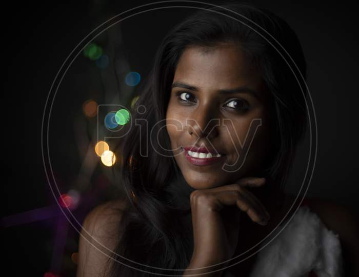 image-of-portrait-of-young-indian-bengali-dark-skinned-brunette-woman-in-santa-clause-lingerie