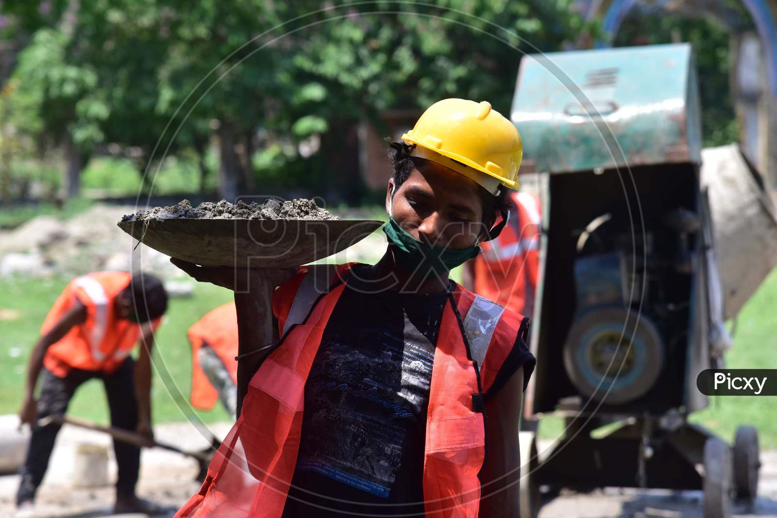 Workers Work On A Construction  Site  After Authorities Eased Restrictions,  During Nationwide Lockdown Amidst Coronavirus Or COVID-19 Pandemic In Nagaon District Of Assam On May 09,2020