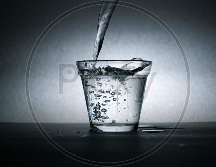 A Glass With Water And Splashes