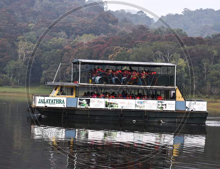 Cruise boat carrying tourist for tour in periyar sanctuary