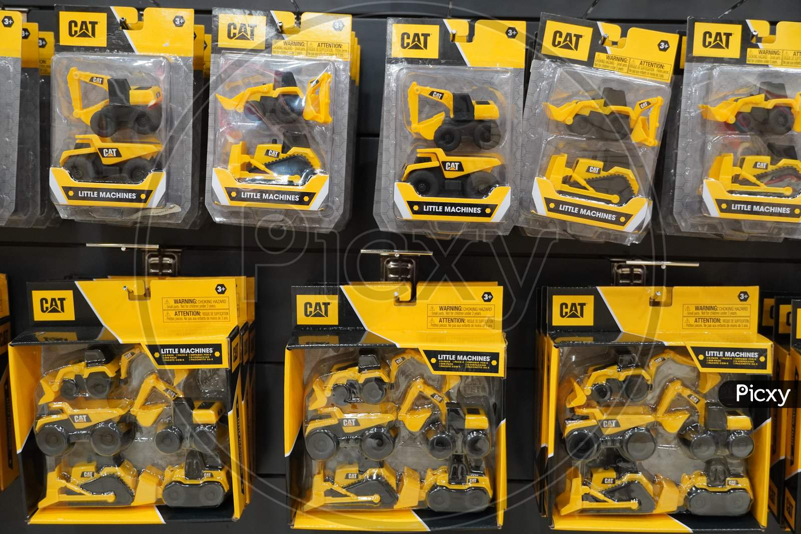 Dubai Uae December 2019 - A Collection Of Cat Excavator And Truck Toys At Toys Store. Toys Hanging In Store For Sale. Cat Brand Toys In A Toy Store.