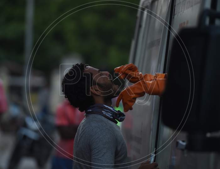 Medics Wearing Protective Suits Collect Swab Samples For Labourers Of Koyambedu Vegetable Market During A Government-Imposed Nationwide Lockdown As A Preventive Measure Against The Spread Of Covid-19 Or Coronavirus, In Chennai