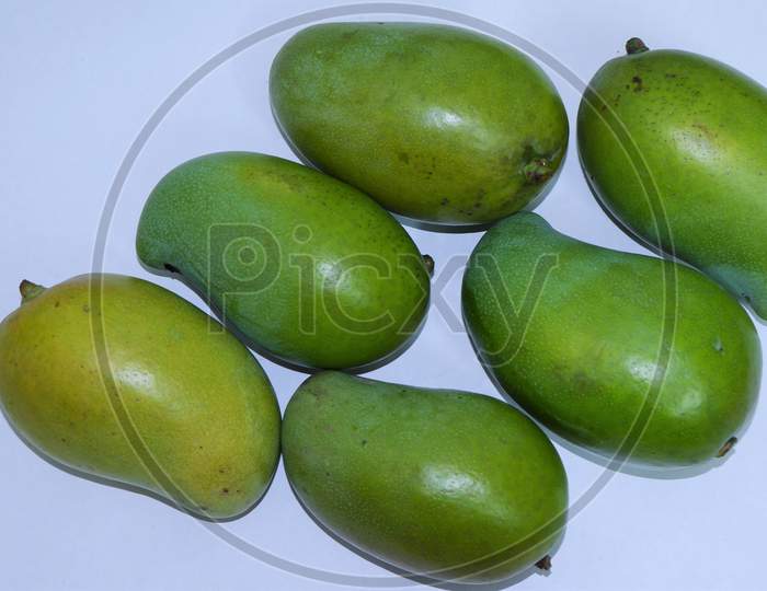 assortment set of green mangoes in white background