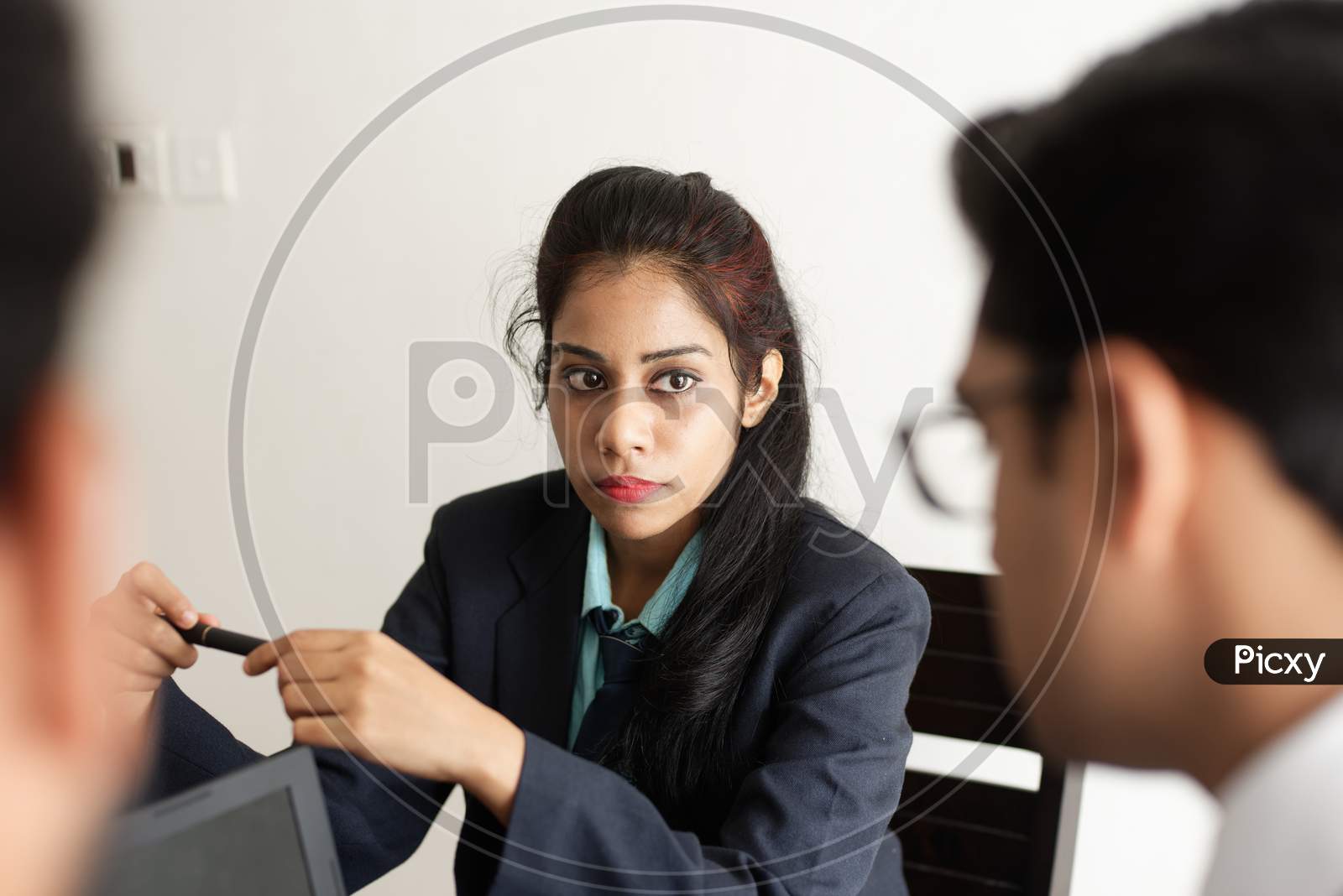 Image of Young and energetic subordinates are discussing with female boss  in Indian office. Indian 