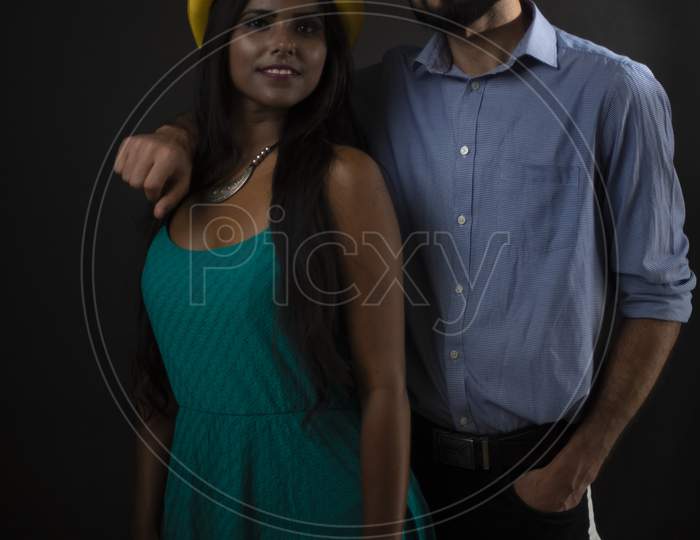 Image Of A Dark Skinned Indian African Girl And A Kasmiri European Arabian Man In Formal Wear