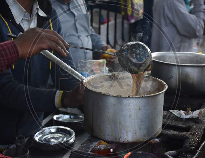 Nainital/India - May 7, 2020: man making tea, on a street in nainital mall road