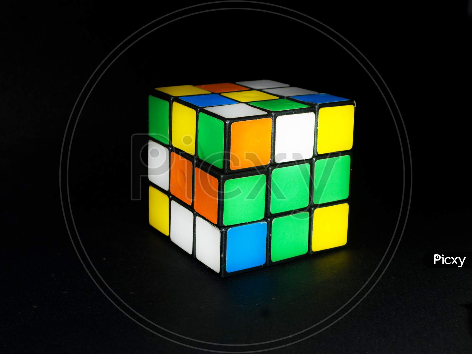 Rubik's cube 3D combination puzzle on an isolated black background