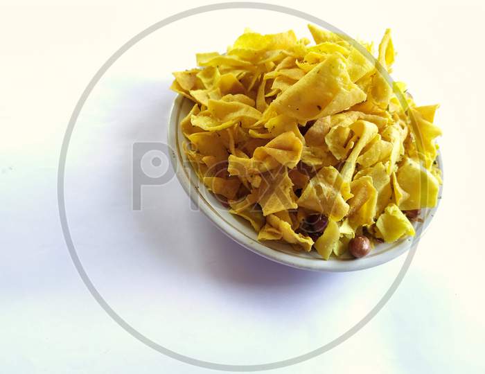 Tasty Indian snacks on plate, White background.