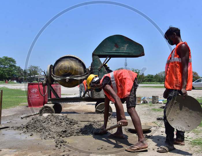 Workers Work  On A Construction  Site  After Authorities Eased Restrictions,  During Nationwide Lockdown Amidst Coronavirus Or COVID-19 Pandemic In Nagaon District Of Assam On May 09,2020