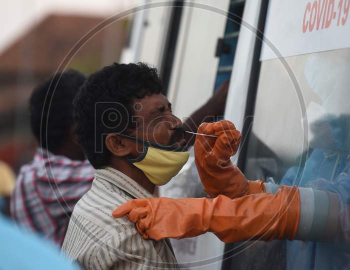 Medics Wearing Protective Suits Collect Swab Samples For Labourers Of Koyambedu Vegetable Market During A Government-Imposed Nationwide Lockdown As A Preventive Measure Against The Spread Of Covid-19 Or Coronavirus, In Chennai