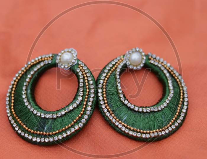 Hand made colorful Earring with nature background