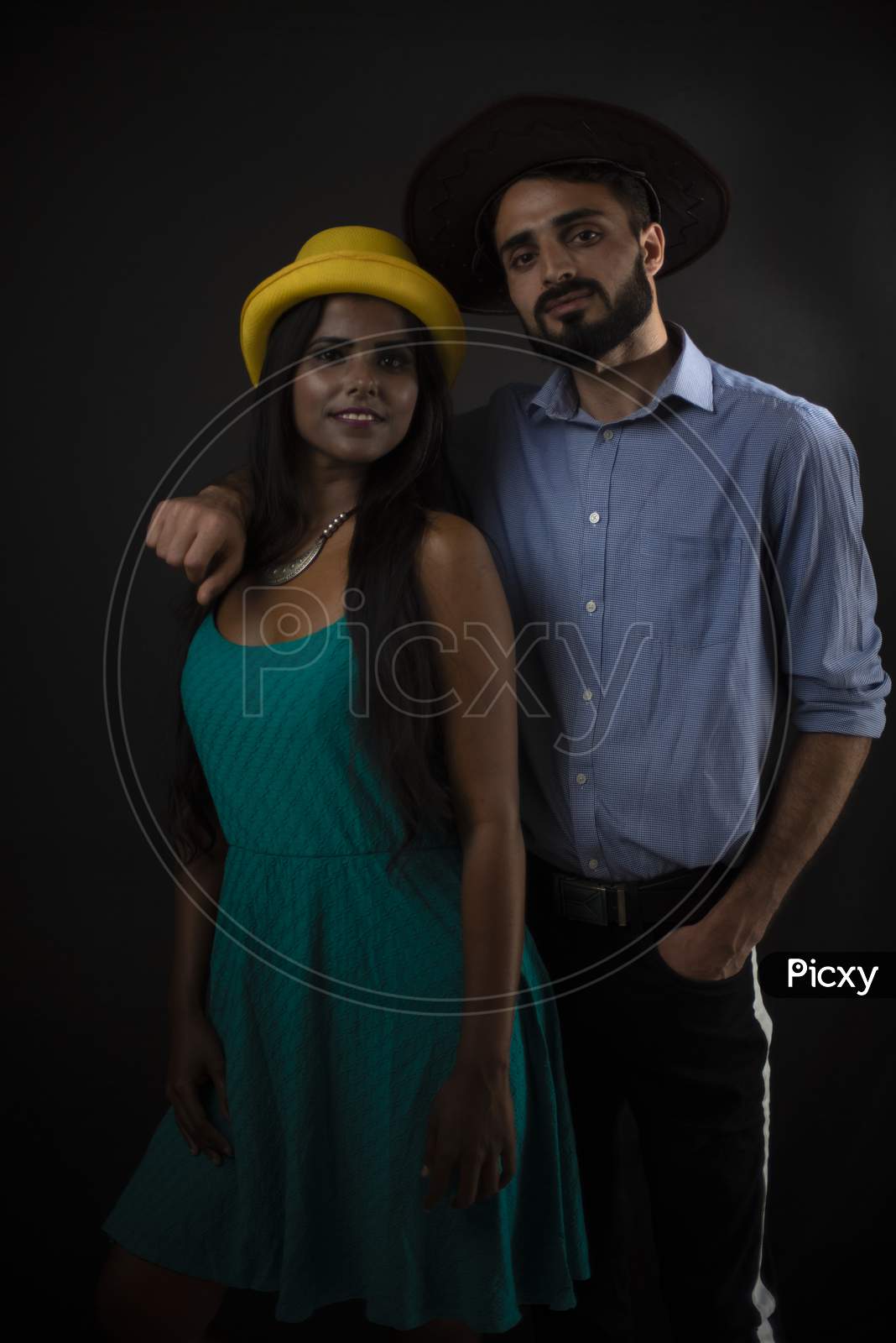 Image Of A Dark Skinned Indian African Girl And A Kasmiri European Arabian Man In Formal Wear