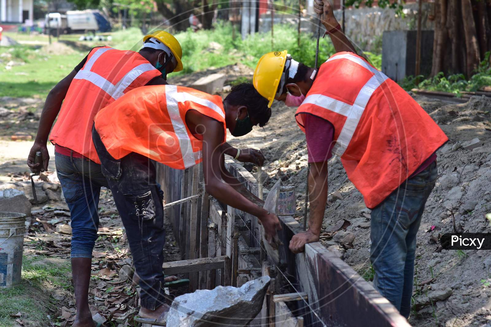 Workers Work  On A Construction  Site  After Authorities Eased Restrictions,  During Nationwide Lockdown Amidst Coronavirus Or COVID-19 Pandemic In Nagaon District Of Assam On May 09,2020