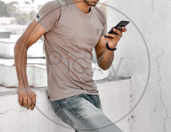 stylish man using mobile phone wearing sunglasses smart look