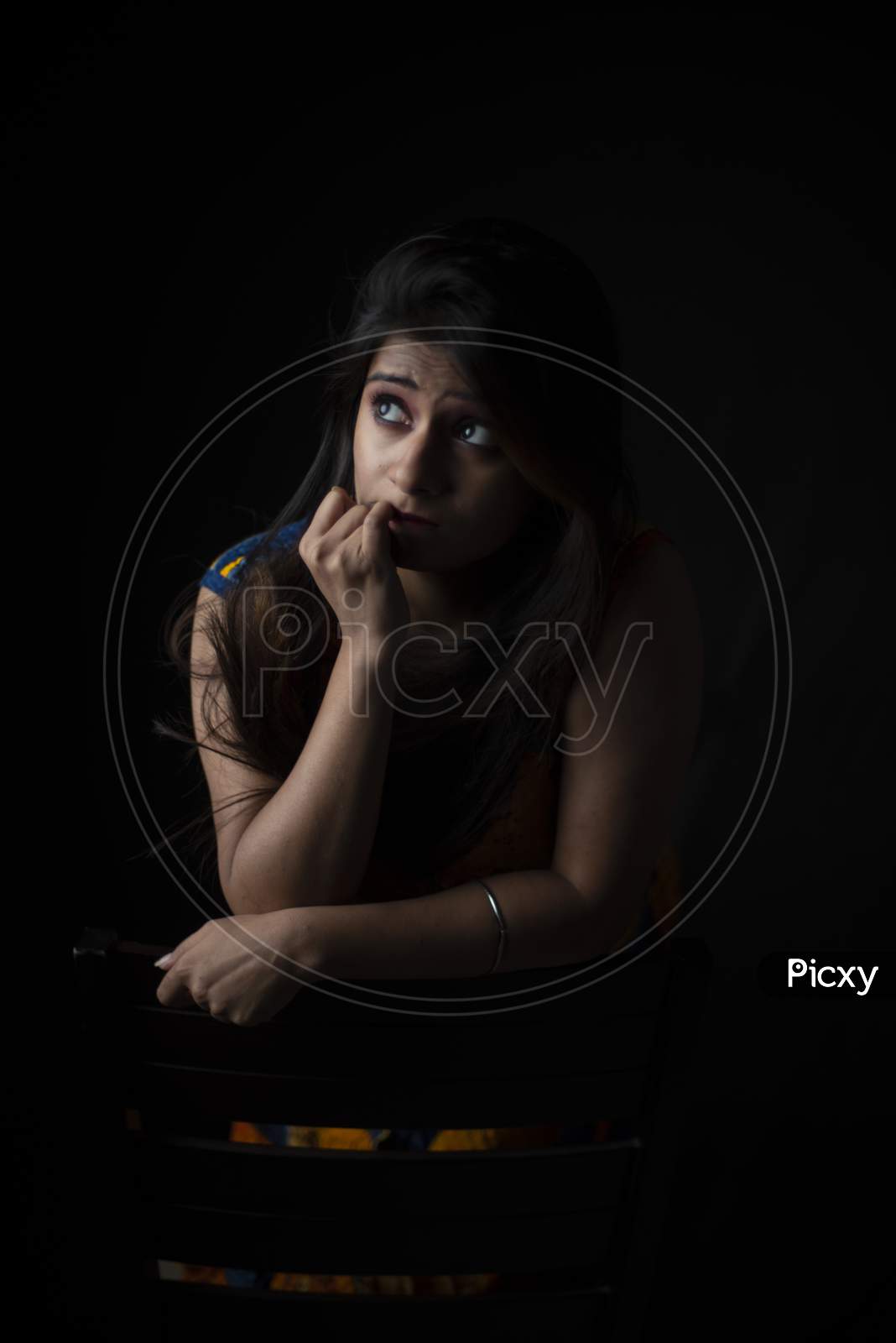 Fashion portrait of young Indian Bengali brunette woman in black