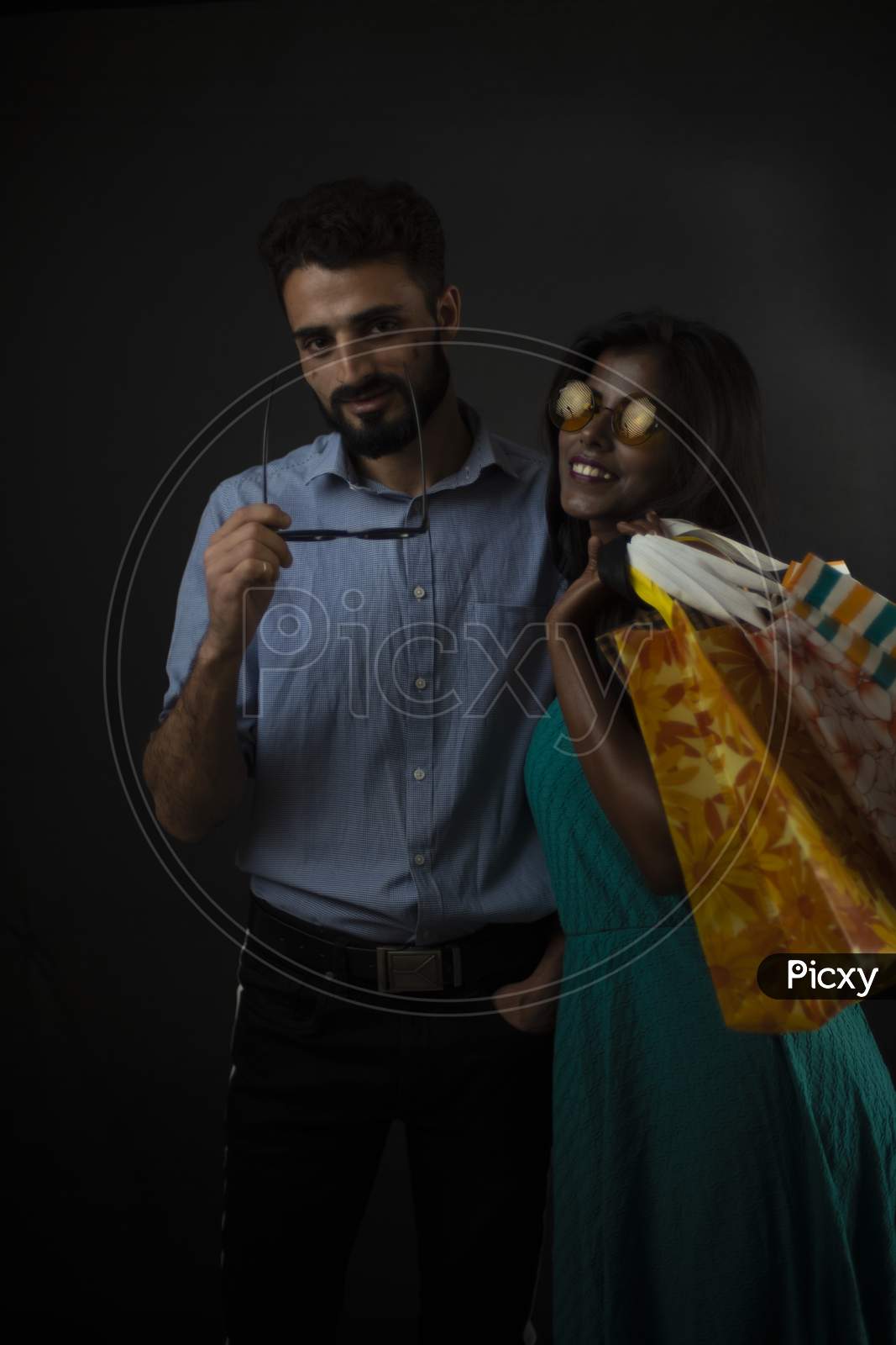 Image Of A Dark Skinned Indian African Girl And A Kasmiri European Arabian Man In Formal Wear