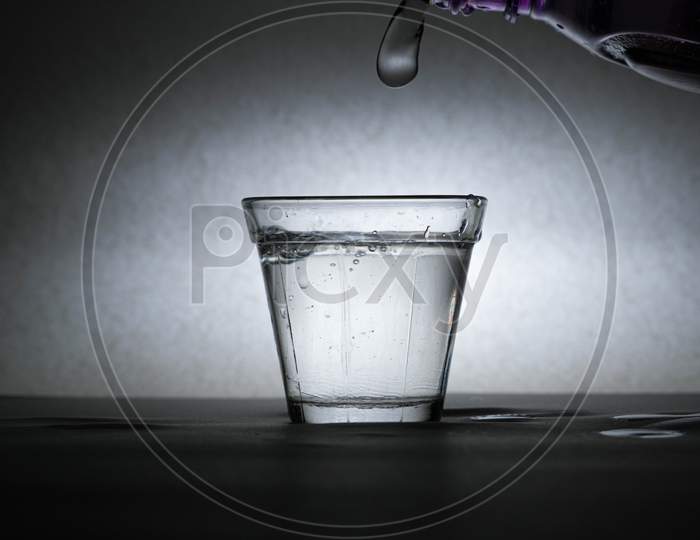 A Glass With Water And Splashes