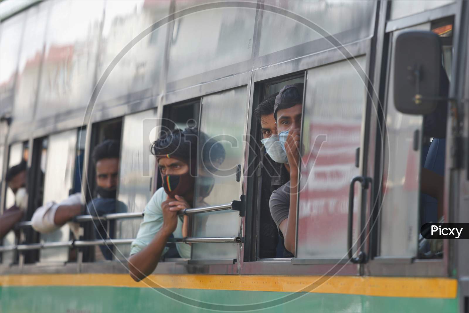 Migrant workers sit inside a bus as they wait to alight to board a special train arranged by the government to repatriate migrant workers from the Chikkabanavara Junction Railway Station on the outskirts of Bangalore, India.