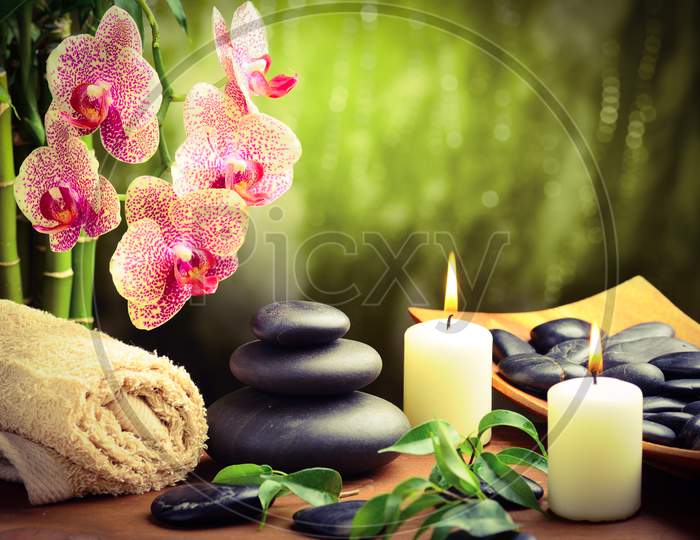 Black stone with candles for spa background