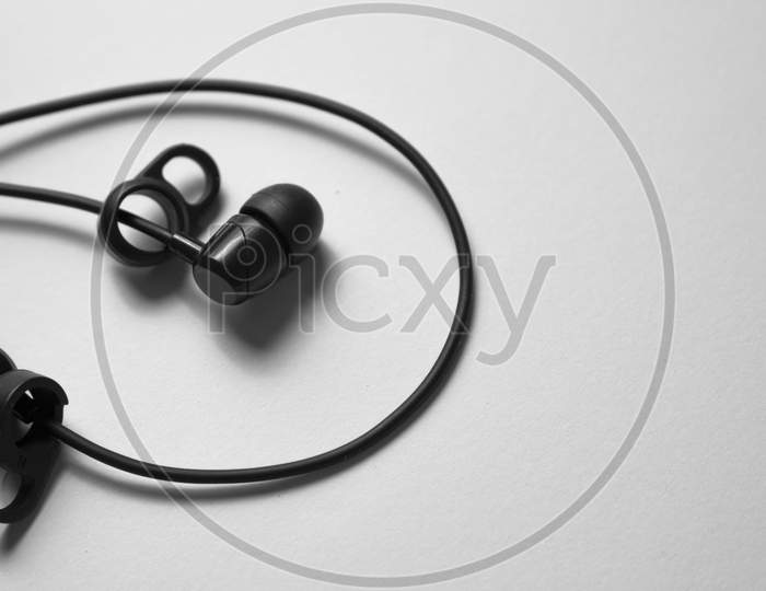 Monochrome Of An Earphone Used To Listen Music.