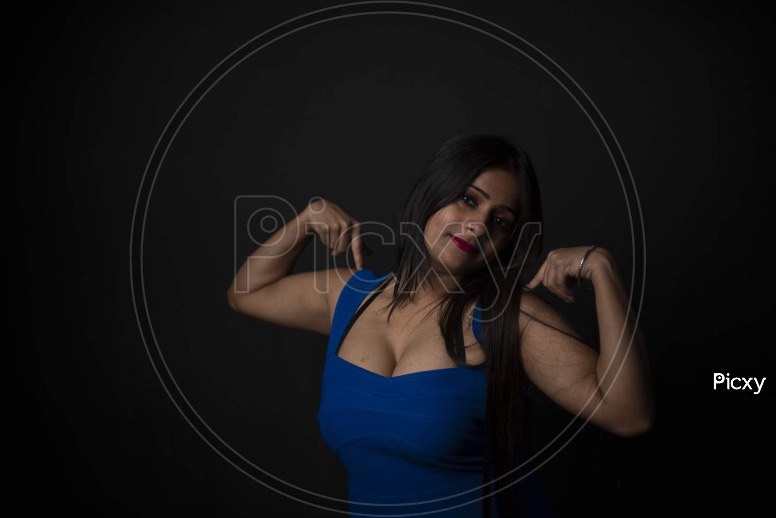 Fashion portrait of young Indian Bengali brunette woman in black