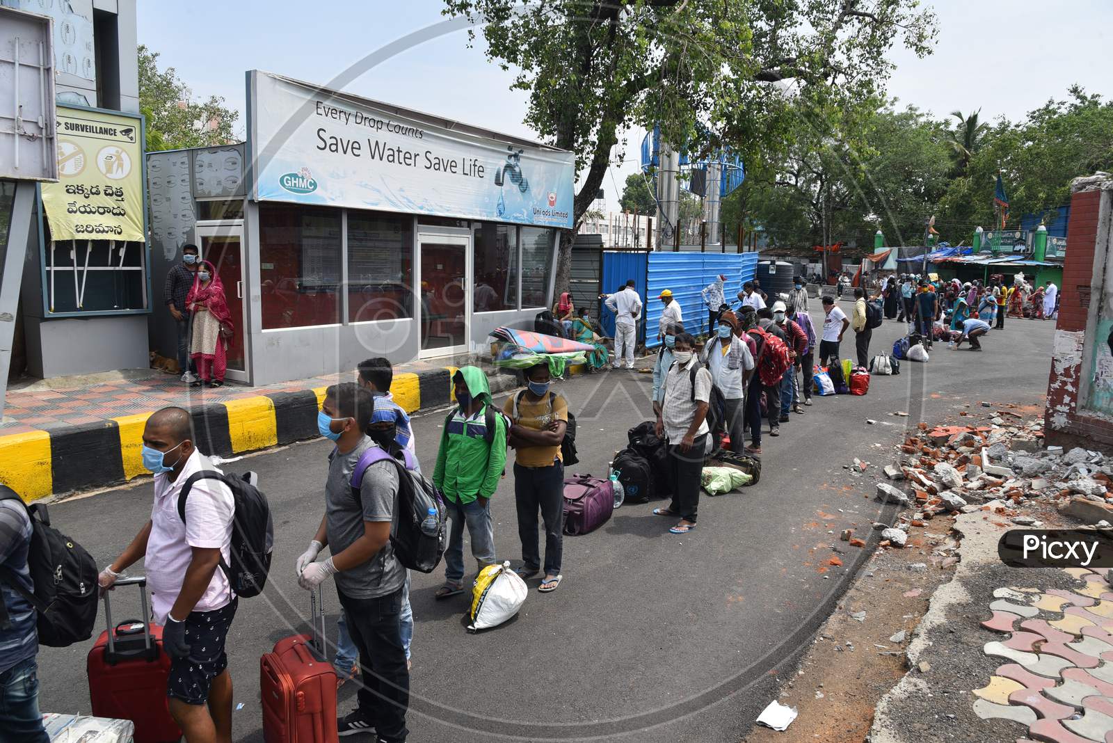 Migrants and Stranded passengers wait outside Secunderabad Railway Station to board trains as Indian Railways resume transport services as government eases restrictions for the ongoing nationwide lockdown amid coronavirus pandemic. June 1, 2020, Hyderabad.