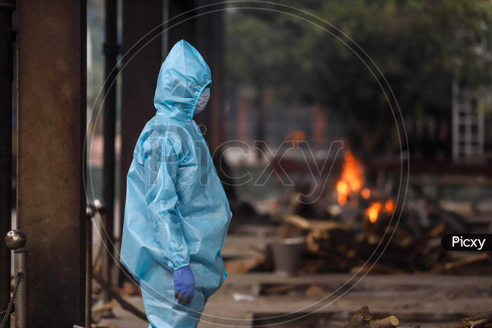 A Relative Of The Deceased Covid-19 patient Wear Hazmat Suits to Perform The Last Rites At Nigambodh Ghat, On May 31, 2020 In New Delhi, India.