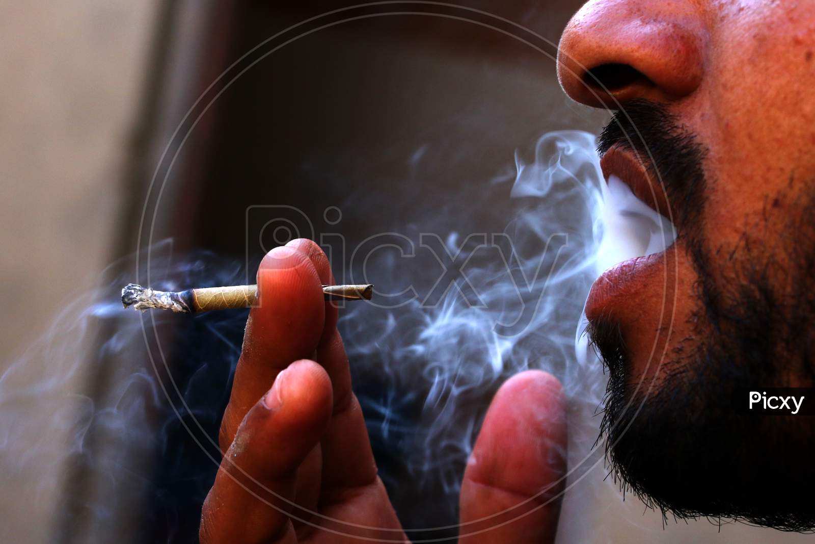 A Man Smokes 'Bidi' A Small Hand Rolled Cigarette On World No Tobacco Day In Ajmer, Rajathan, India On May 31, 2020.