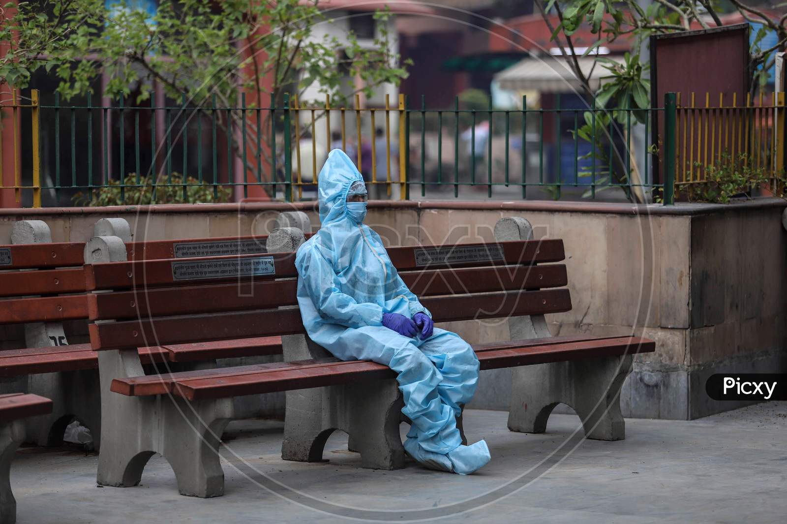 A Relative Of The Deceased Covid-19 patient Wears Hazmat Suit to Perform The Last Rites At Nigambodh Ghat, On May 31, 2020 In New Delhi, India.