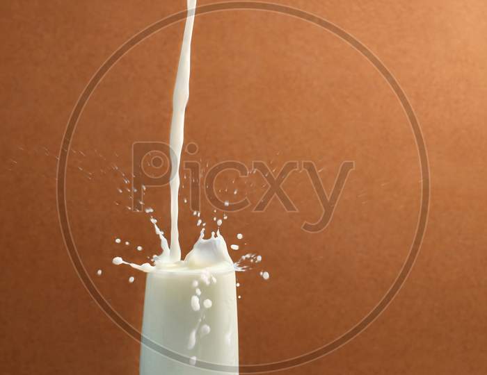 Milk pouring into a glass